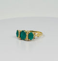 Ring with diamonds and emeralds