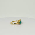 Ring with natural diamonds and emeralds on the side