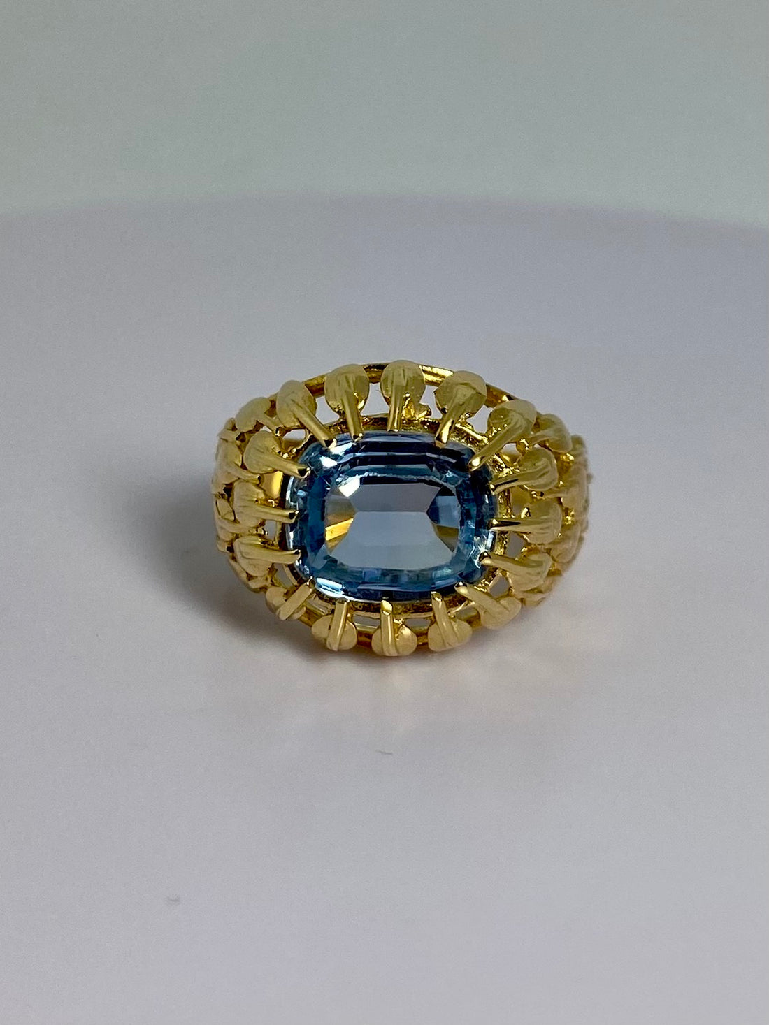 Ring with blue spinel front