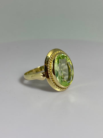 Ring with green olivine