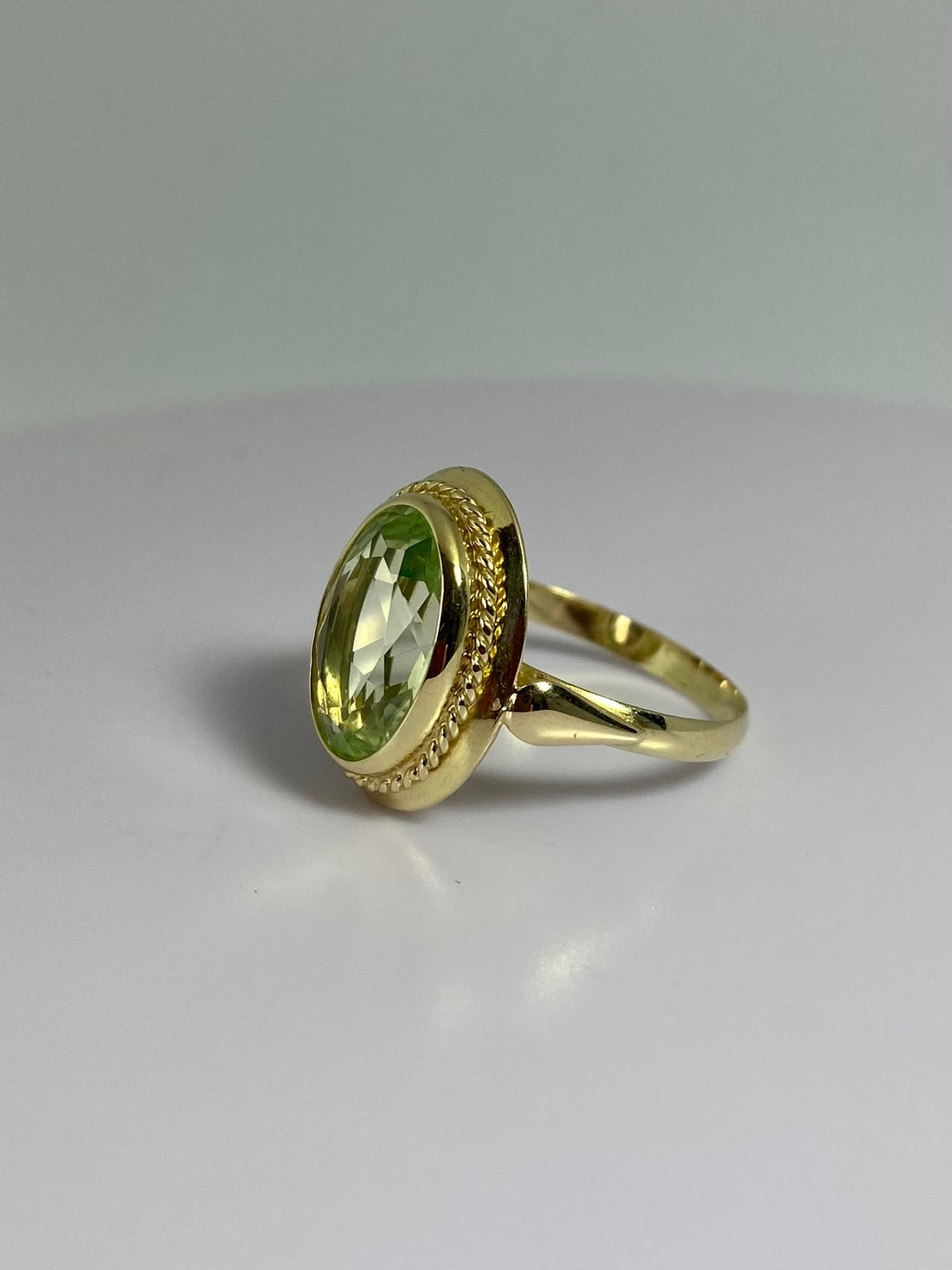 Ring with green olivine