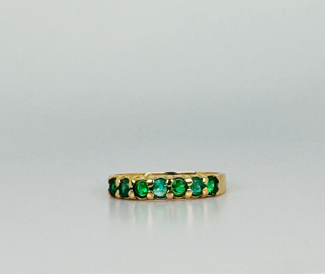 Ring with green stones 