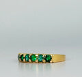 Ring with green stones 