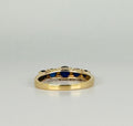 Ring with dark blue sapphires