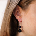 Antique earrings with garnet on ear